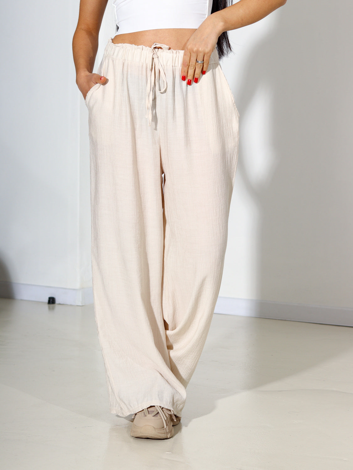 Bēšas viskozes brīvi krītošas bikses - 14301