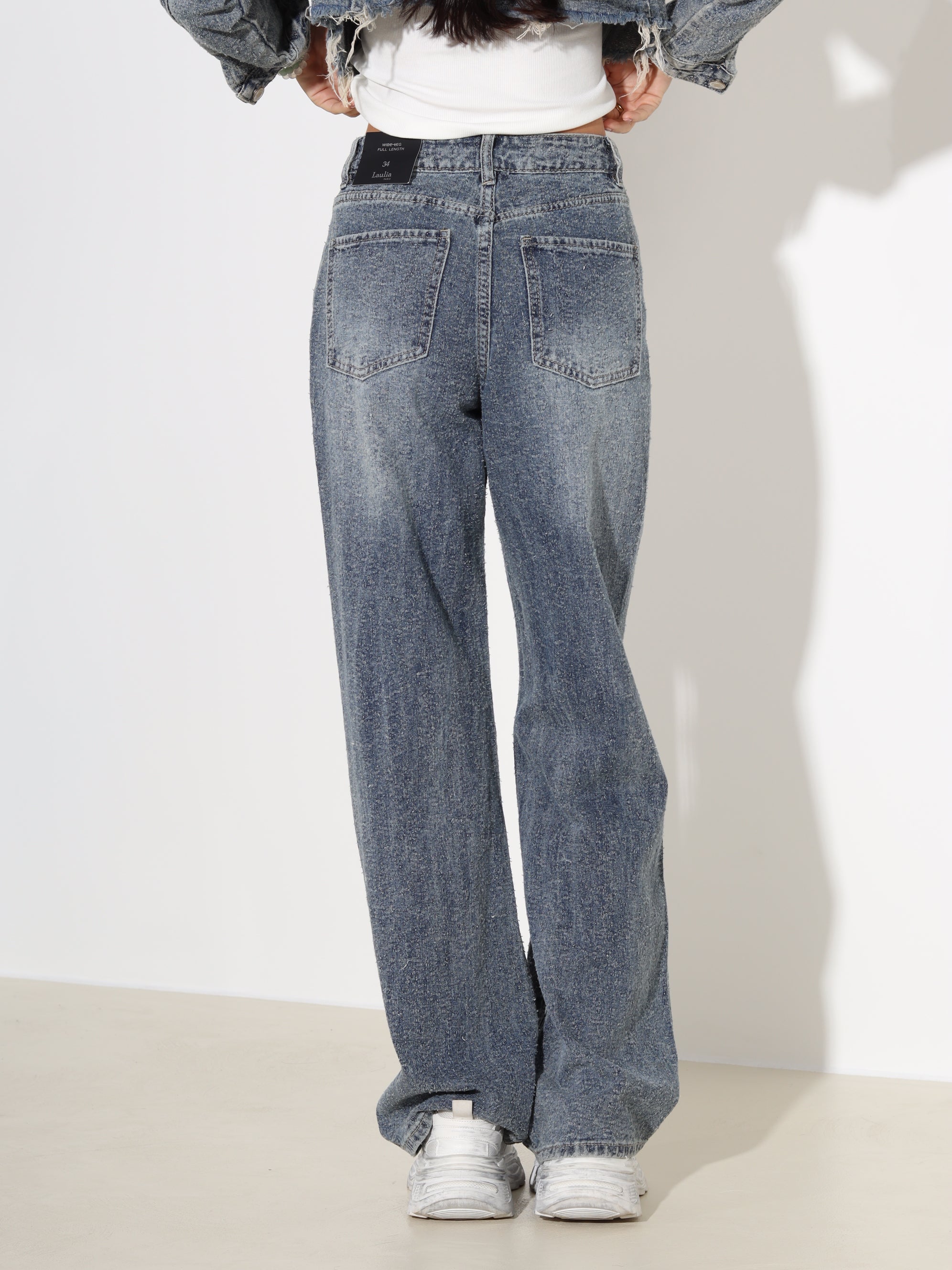 Zilganzaļas džinsa püksid ar raustītu diedziņu - 18165