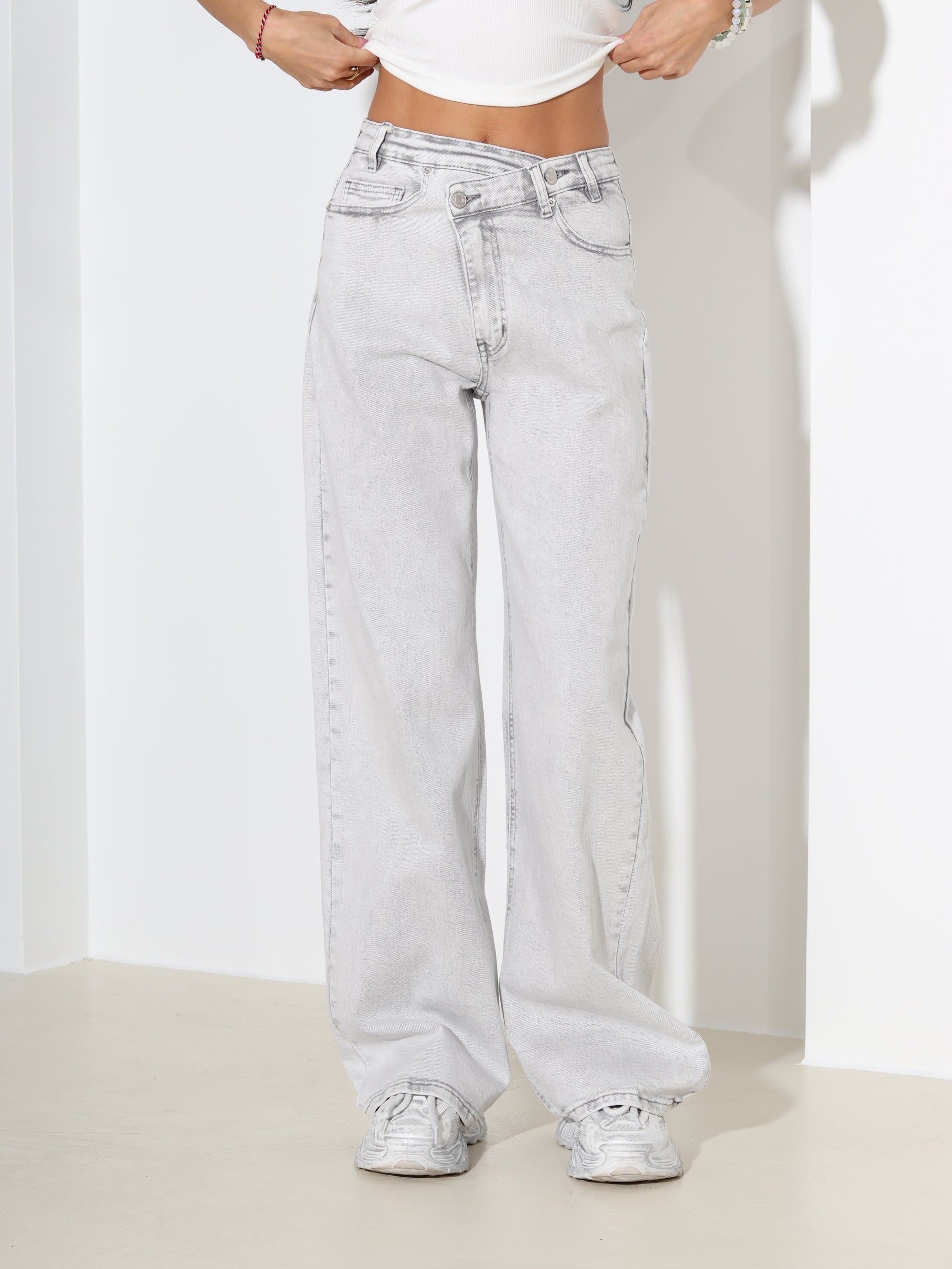 G.pelēkas džinsa püksid ar slīpu pogas aizdari - 18168