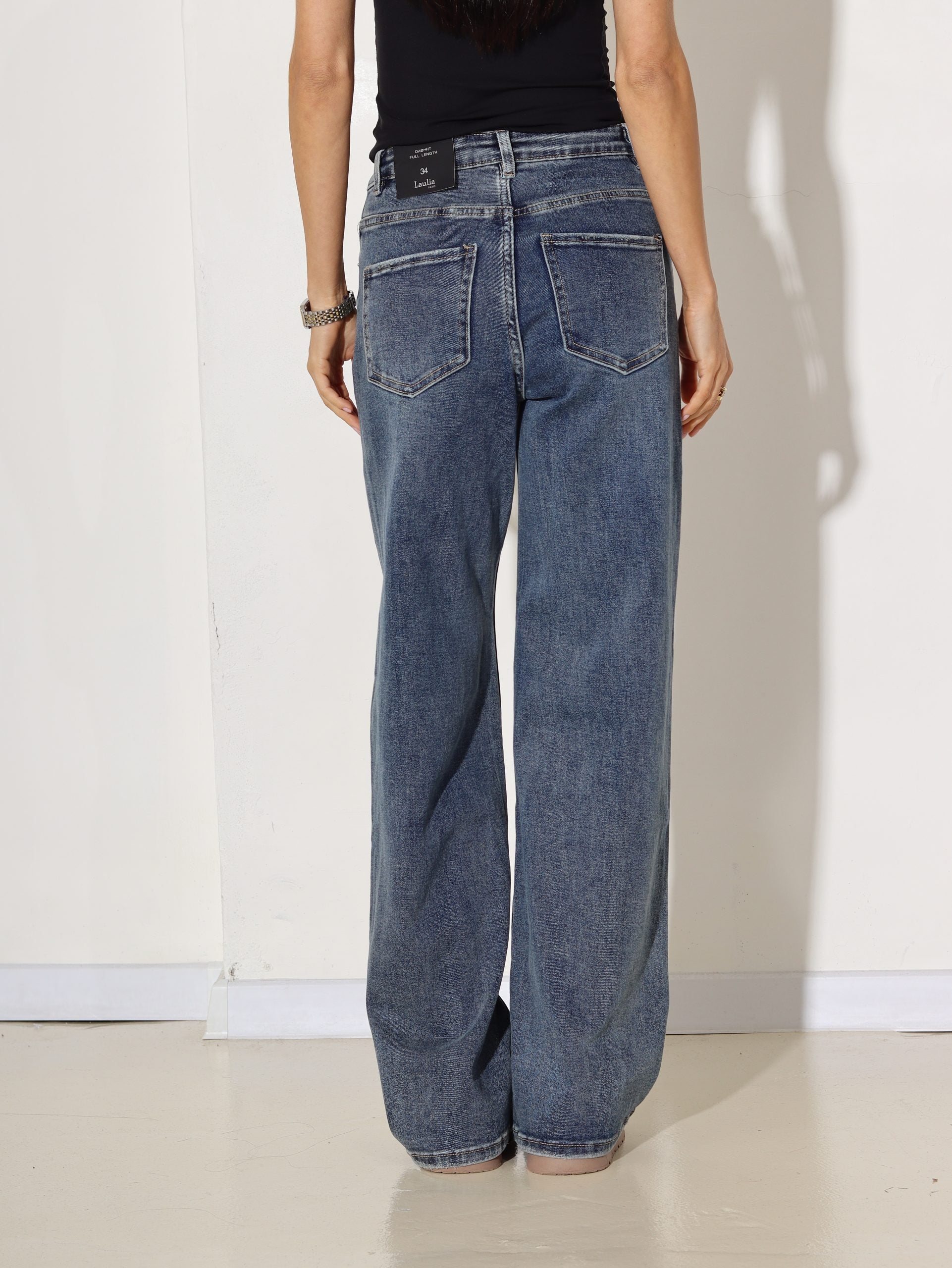 Zilas džinsa bikses ar slīpu pogas aizdari - 16921